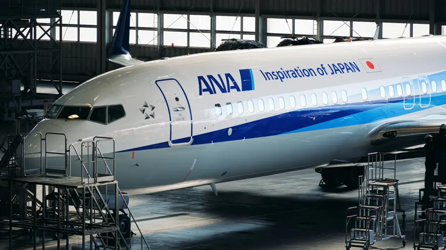 Commercial aircraft forward fuselage in a maintenance hangar